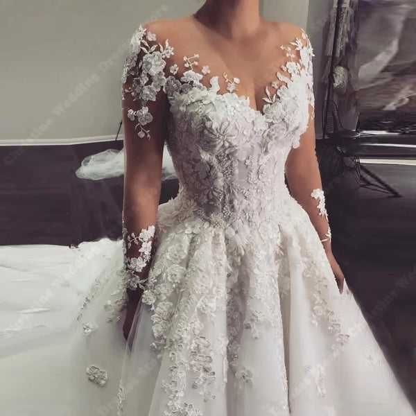 Elegant Floral Print Tulle Bridal Gown with Long Sleeves and V-Neck Design